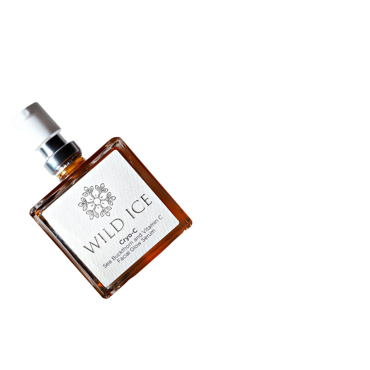 A bottle of Cryo-C vitamin C glow serum lying flat, photographed from above against a plain white background