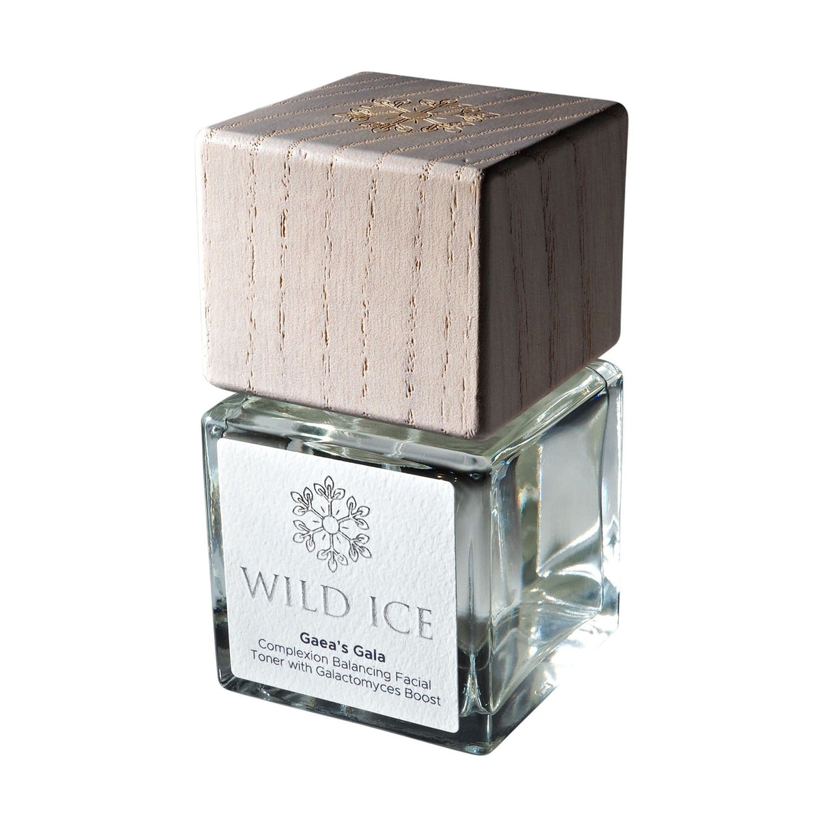 A bottle of Gaea's Gala galactomyces ferment toner wearing its wood overcap, against a plain white background