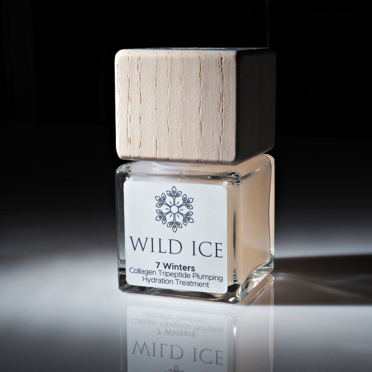 A bottle of 7 Winters collagen tripeptide serum wearing its wood overcap, lit against a dark studio background