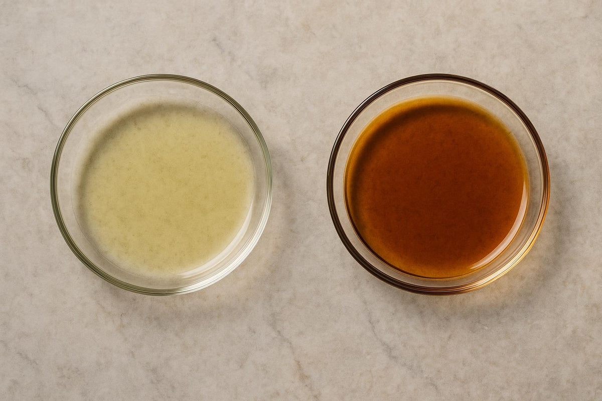 Two small glass dishes of the same botanical oil side by side, one bright and thin-bodied, the other darkened and thickened with a tacky rim after months of warmth