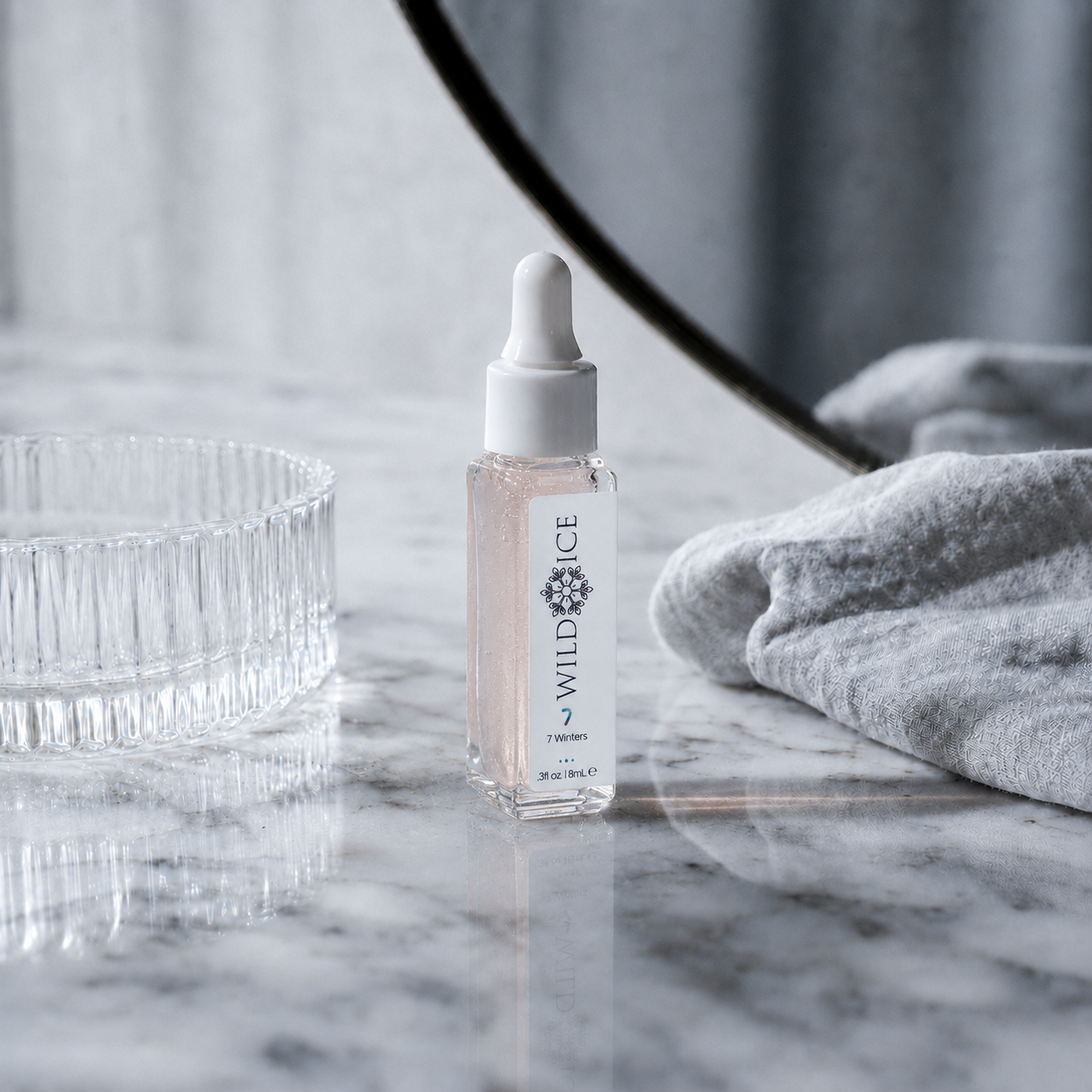 Mini 7 Winters Collagen Tripeptide Plumping Hydration Treatment, cold-preserved skincare by Wild Ice Botanicals, on a vanity