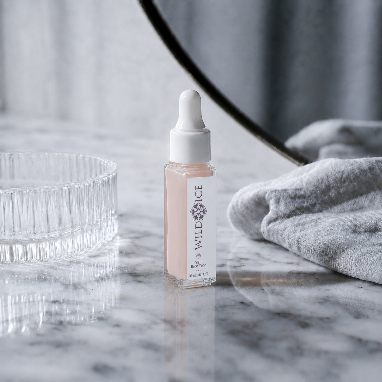 Mini D.B.T. Baba Yaga: Siberian Cold Cream Therapy For Face, Neck, and Eyes, cold-preserved skincare by Wild Ice Botanicals, on a vanity