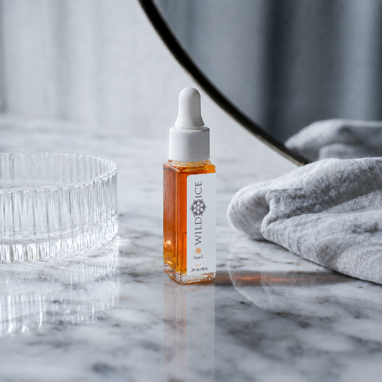 Mini Cryo-C: Vitamin C Glow Serum, cold-preserved skincare by Wild Ice Botanicals, on a vanity